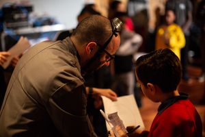 Dr. Bray investigating evidence with a student in the Digital Ghost Hunt